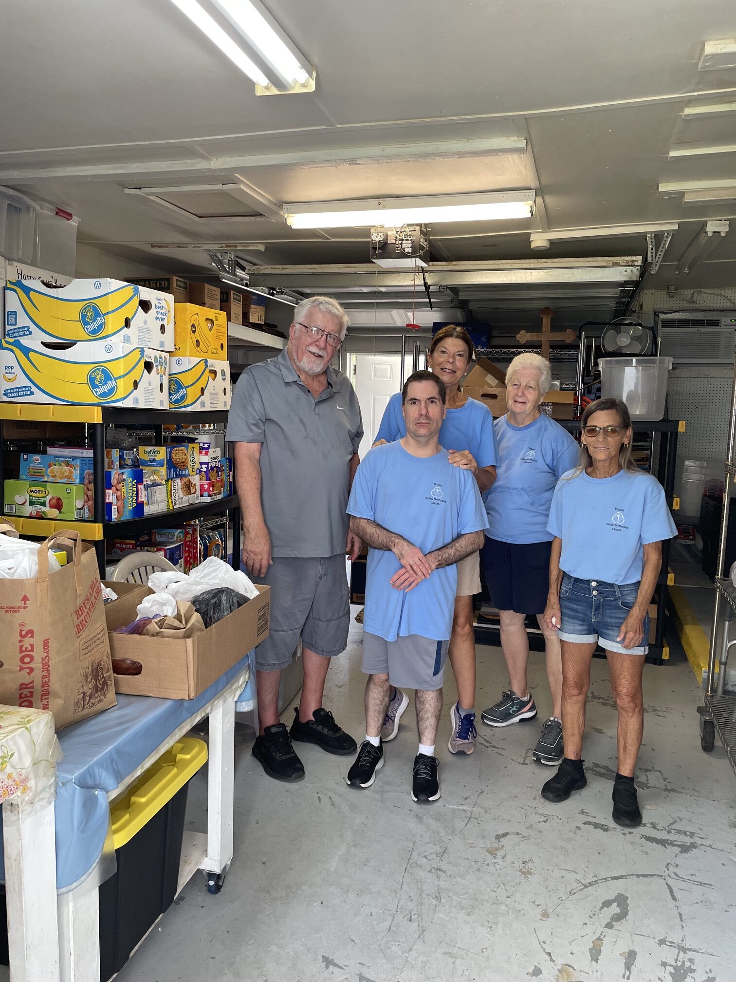Volunteers organizing food at Trinity Food Pantry